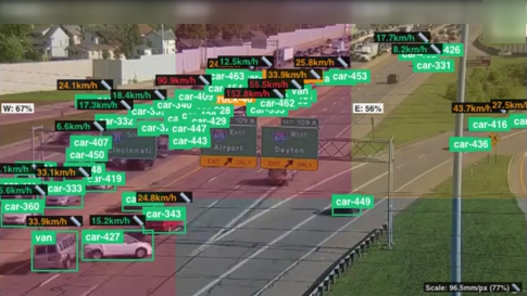 StreetSense tracking view: vehicles detected and tracked with IDs, per-vehicle speed estimates and zone-level congestion overlays on a live highway camera feed